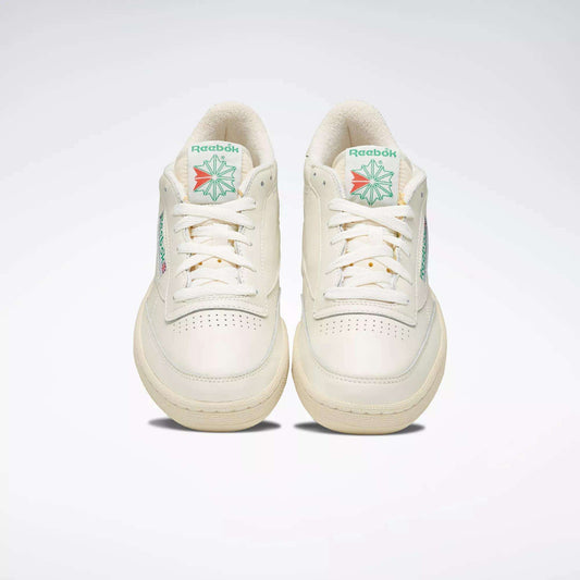 A pair of off-white Reebok Club C 85 Vintage Shoes with leather uppers and green and red logo details on the tongue, shown from the front against a plain light background.