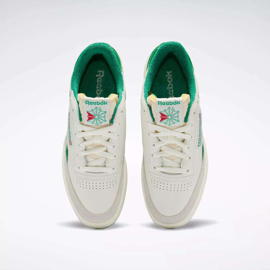 A top view of the Men's Club C Revenge Vintage Shoes by Reebok, white with green interiors and accents. These tennis-inspired sneakers feature the Reebok logo, tongue detailing, and perforated toes for retro style.