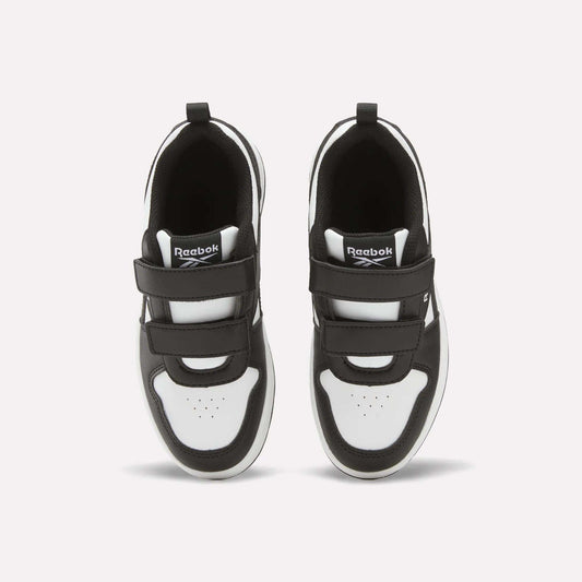 A pair of black and white Kids' Reebok Royal Prime 2 Shoes - Little Kids with hook-and-loop straps, seen from above, feature the Reebok logo on the tongue and perforated toe box detail.