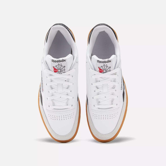 A pair of Men's Club C Revenge Vintage Shoes by Reebok in white leather with brown gum soles, shown from above. Features include perforated toe boxes, the Reebok logo, and a red and grey star emblem on the tongue.