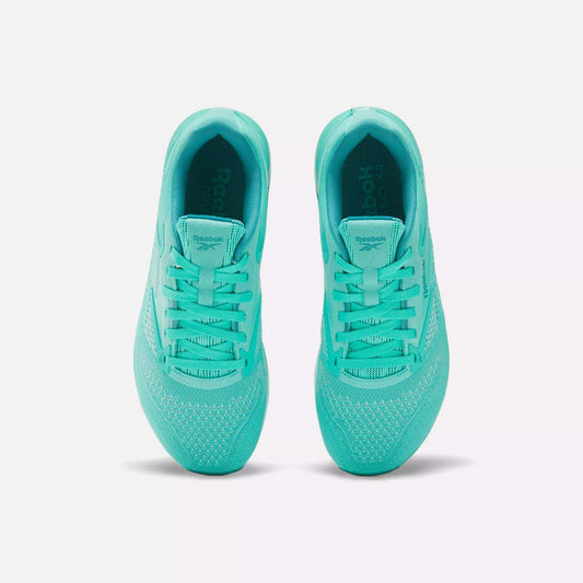 A pair of Women’s Nano X4 Training Shoes by Reebok in bright teal, shown from above on a white background. These lightweight shoes have mesh uppers, teal laces, and prominent Reebok branding on the tongue.