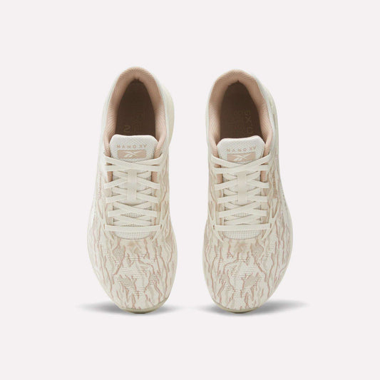 A pair of beige Reebok Nano X5 Training Shoes for men, seen from above, with subtle wavy patterns, light-colored laces, and a comfortable inner lining.