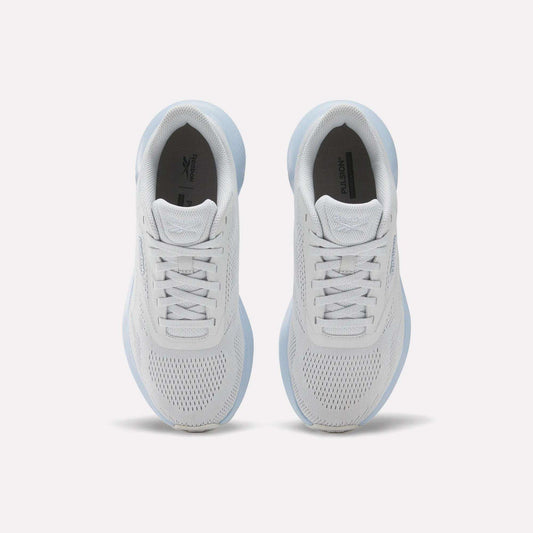 Top view of Reebok Women's Energen Run 4 Running Shoes featuring breathable mesh uppers and laces, placed side by side on a light background.