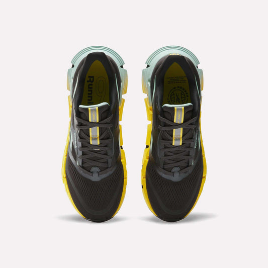 The Reebok Men's FloatZig 2 Running Shoes in black and yellow feature Superfloat+ cushioning for added comfort.