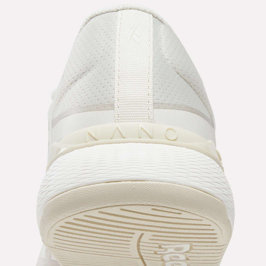 Close-up rear view of the Reebok Women's Nano X5 Training Shoes, featuring 'NANO' embossed above the textured rubber sole and subtle stitching details on the heel—perfect for women's training shoe collections.