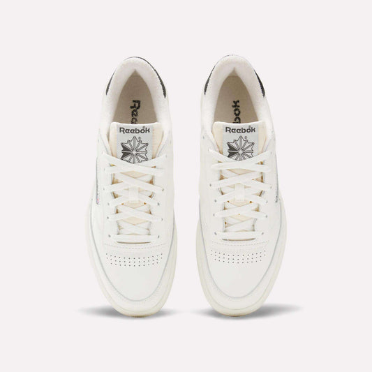 A top view of Reebok Club C 85 Vintage Shoes in white, showing leather uppers with perforated toe boxes, lace-up fronts, branded tongues, subtle gray heel accents, and lightweight cushioning for comfort.