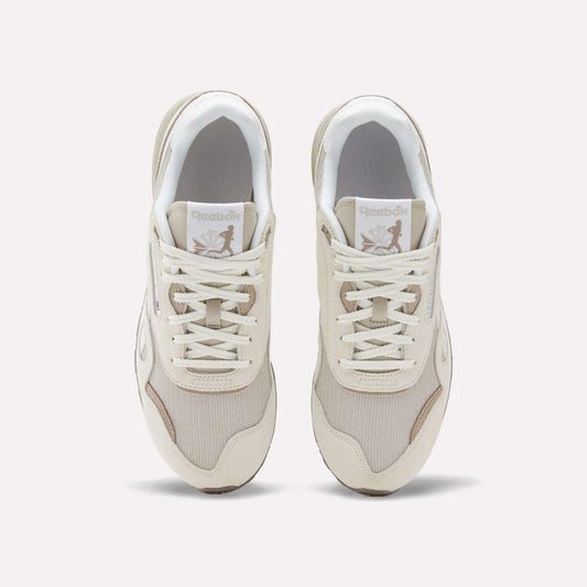 A pair of Reebok Classic Nylon 89 Shoes in beige and white, viewed from above, display mesh and suede details, laces, a cushioned midsole, and the Reebok logo on each tongue.