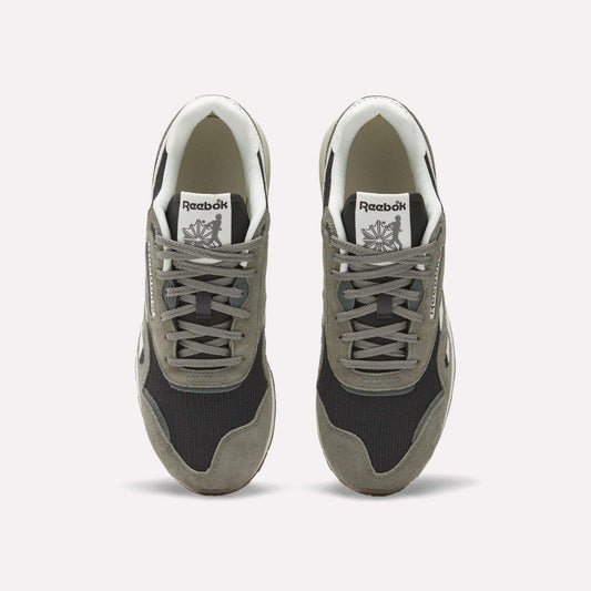 A pair of Reebok Classic Nylon 89 Shoes seen from above, with gray suede overlays, black mesh panels, white midsoles and interiors. Each heritage sneaker displays the Reebok logo on the tongue.