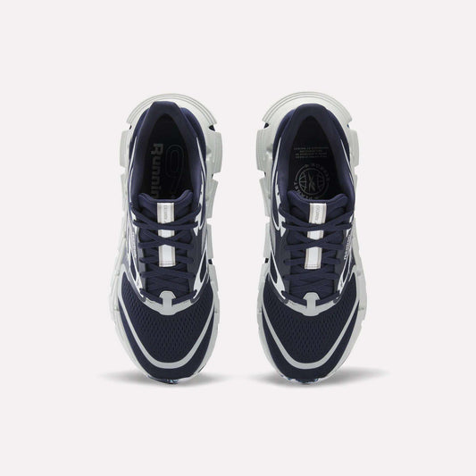 A pair of Reebok FloatZig 2 Running Shoes in navy blue and white are shown from above on a white background. They feature mesh uppers, Superfloat+ cushioning, white accents, and chunky white soles.