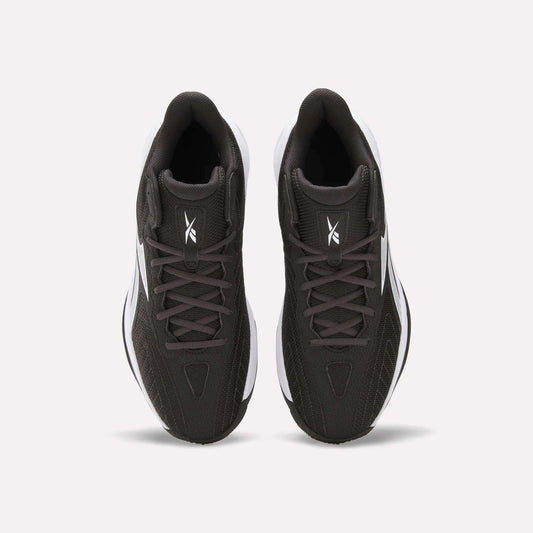 Top view of Reebok Press Basketball Shoes in black with white soles and logo on the tongue, shown side by side on a white background. These shoes offer responsive comfort with EVA cushioning.