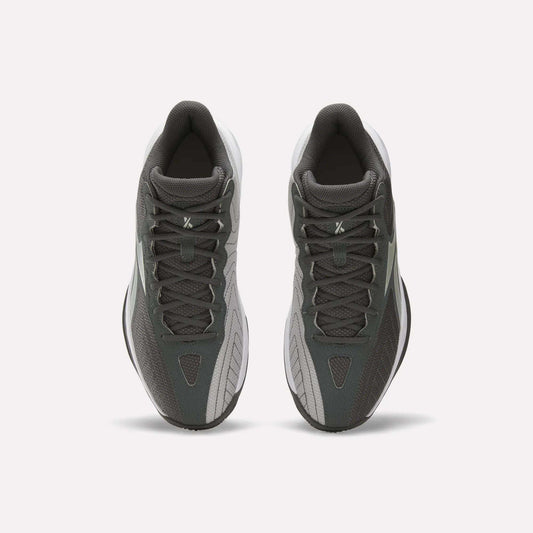 A pair of Reebok Press Basketball Shoes in dark gray and light gray are shown from above, highlighting their laces and classic basketball style against a plain white background.