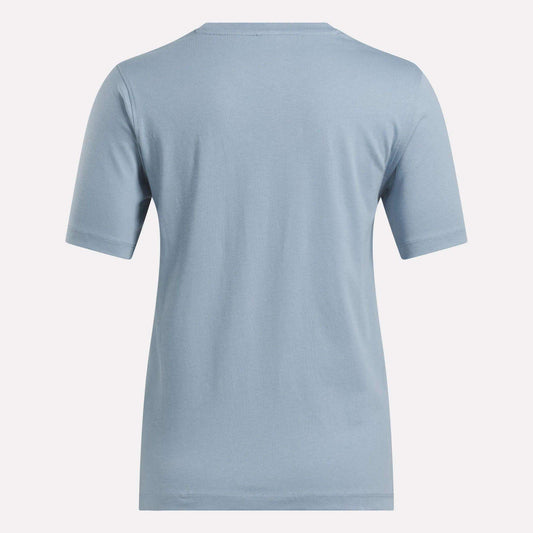 Shown from the back, the Reebok Women's Big Logo Crewneck Short Sleeve Tee in light blue features a plain, soft cotton jersey design with no visible logos, patterns, or graphics.