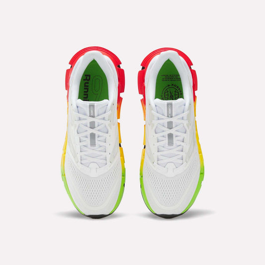 The Reebok Men's FloatZig 2 SoleMates Running Shoes are shown from above, featuring red heels, yellow lightweight foam midsoles, green toes, mesh uppers, white laces, and black outsole accents on a light background.
