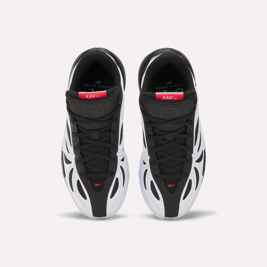 Top view of Reebok Angel Reese 1 Shoes for big kids in black and white with red and gray accents, wavy white side overlays, sleek design, and branded insoles with visible text near the heel.