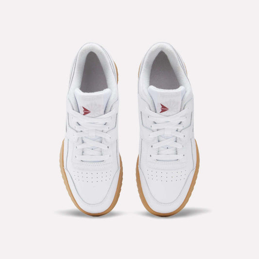 A top view of Reebok Workout Plus Ripple Shoes in white leather with gum soles, white laces, perforated toe boxes, and red Reebok logos on the tongues adds a subtle vintage touch.