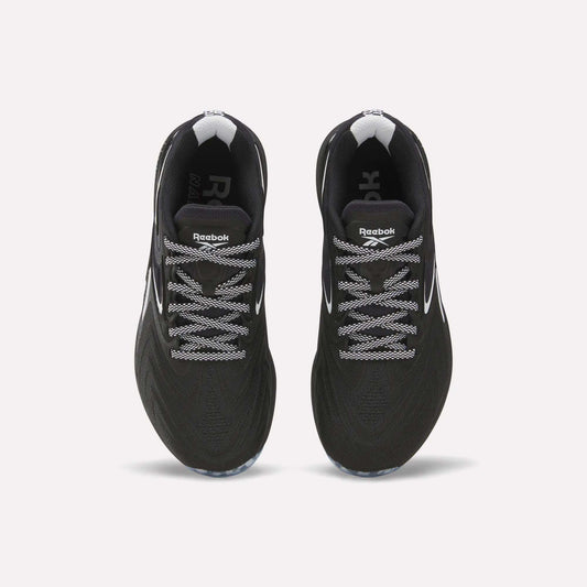 Top view of Reebok Women's Nano X5 Edge Training Shoes in black with white laces and accents, displayed side by side on a plain white background.