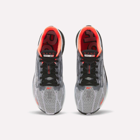 A pair of Reebok Nano Pro Training Shoes in gray and black with red inner linings and NANO branding on the insoles, shown from above against a white background—ideal for athletes aiming for peak performance.
