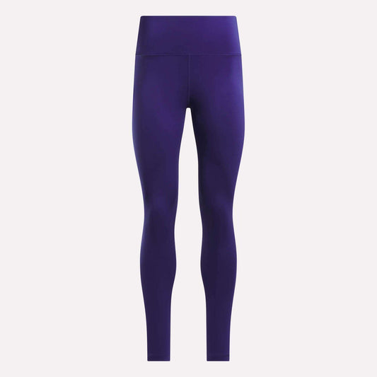 Front view of Reebok Women's High-Rise Leggings in solid dark purple, featuring full-length coverage and crafted from RBK-DRY fabric, displayed against a plain white background.