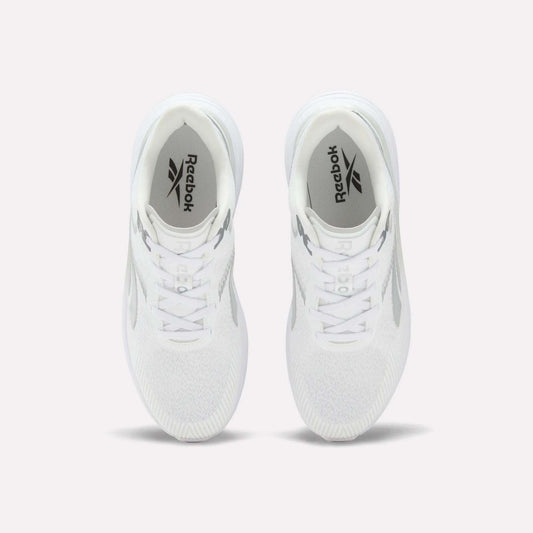 A pair of Men’s Viva Speed Shoes by Reebok in white is displayed from above on a light background, highlighting the Reebok logo on the insoles and the mesh uppers for enhanced breathability.