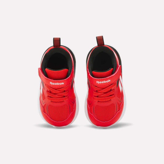 The Reebok Rush Runner 6.0 Gore Lace Top Strap Running Shoes for baby and toddler boys feature bright red mesh uppers, white accents, Velcro straps, pull tabs, and EVA-cushioned white soles, shown from above on a plain white background.
