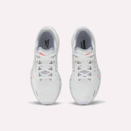 A pair of Women's FloatZig Tread Running Shoes by Reebok, viewed from above, with a breathable mesh upper, grey accents, and small orange Reebok logos on each tongue—perfect for treadmill workouts.
