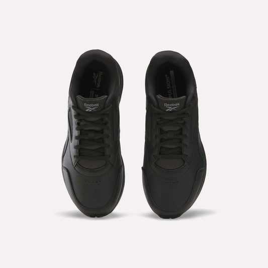 A pair of black Men's Walk Ultra 7 DMX Max Shoes - Wide 4E by Reebok is shown from above, highlighting the laces, toe area, and Reebok branding on the tongues, set against a plain white background. These wide-fit walking shoes are equipped with DMX cushioning for added comfort and support.