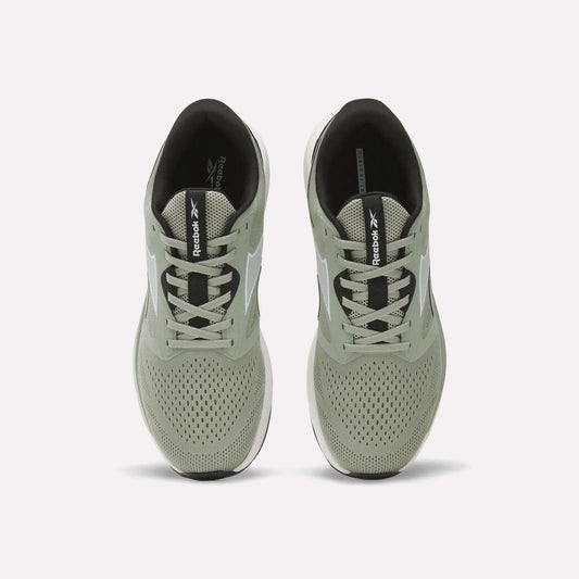 A pair of light green Reebok Men's Nanoflex 2 Training Shoes is shown from above, highlighting the laces, breathable mesh uppers, and black insoles featuring Reebok branding.