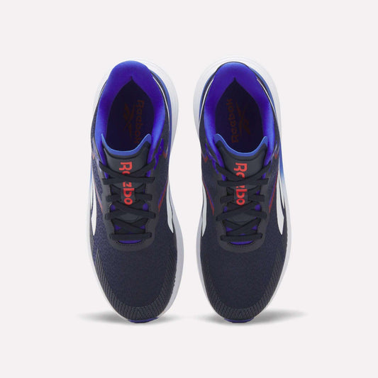 A pair of Reebok Men's Viva Speed Shoes in navy blue, featuring white soles, red Reebok logos on the tongues, and a purple inner lining, are displayed from a top view against a white background. Designed for both comfort and performance, these cushioned shoes are ideal for men seeking style and support.