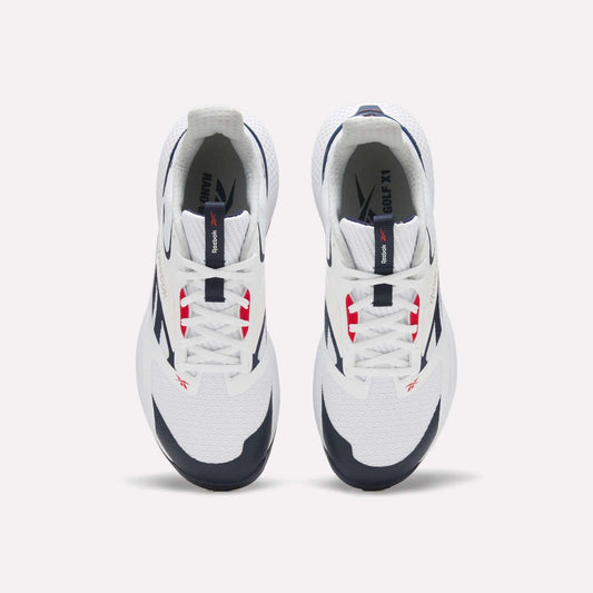 Top view of a pair of white Reebok Nano Golf Shoes with navy and red accents, white laces, black outsoles, and lightweight FlexWeave for comfort, positioned side by side on a plain light background.