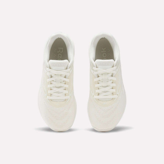 The Reebok Nano X5 Women's Training Shoes, shown from above on a plain white background, highlight their white color, laces, mesh texture, and soles.