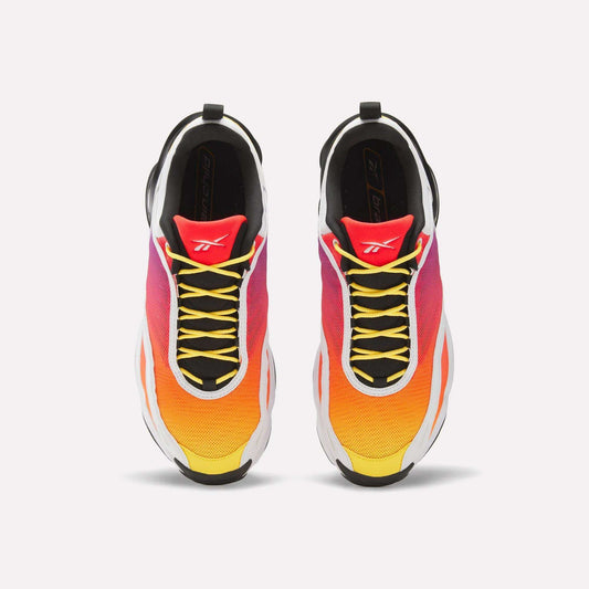 Top view of Reebok x Brain Child DMX Series 3000 Shoes with a yellow-to-orange-pink gradient, black laces, white midsoles, red tongues with a white logo, and responsive cushioning for all-day comfort.