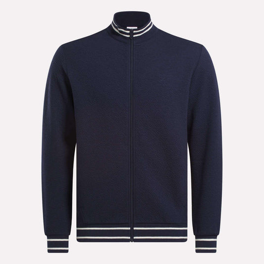 The Reebok Men's Club Sport Textured Jacket is a navy zip-up with thermal knit fabric and white/navy striped ribbed collar, cuffs, and hem, shown on a plain white background.