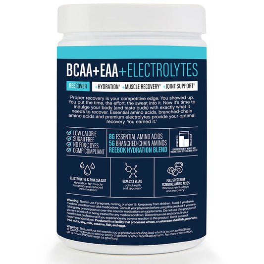 A white Reebok container labeled "ReeCover BCAA + EAA + Electrolytes" promotes muscle recovery and hydration. Blue and white text displays features, nutrition info, and details about Essential Amino Acids clearly.