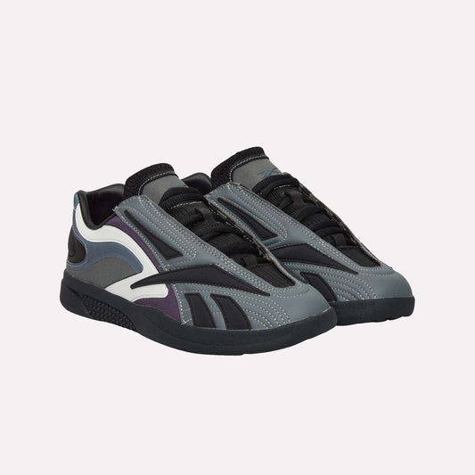 The Reebok Hammer Pro LTD Shoes feature a modern, sleek design in gray, black, and white with black laces, textured soles, layered side details, and premium faux leather accents.