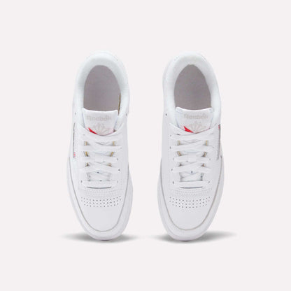 A pair of Reebok Women's Club C 85 Shoes are shown from above on a white background, highlighting their laces, perforated toe area, and the Reebok logo on the tongue.