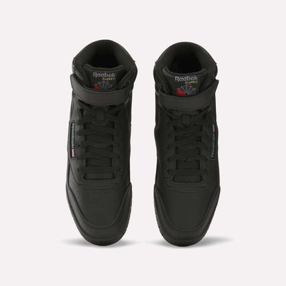 A pair of black Reebok Men's EX-O-FIT Hi shoes with an old-school design, viewed from above, featuring perforated toes, laces, and Reebok branding on the tongues and sides.