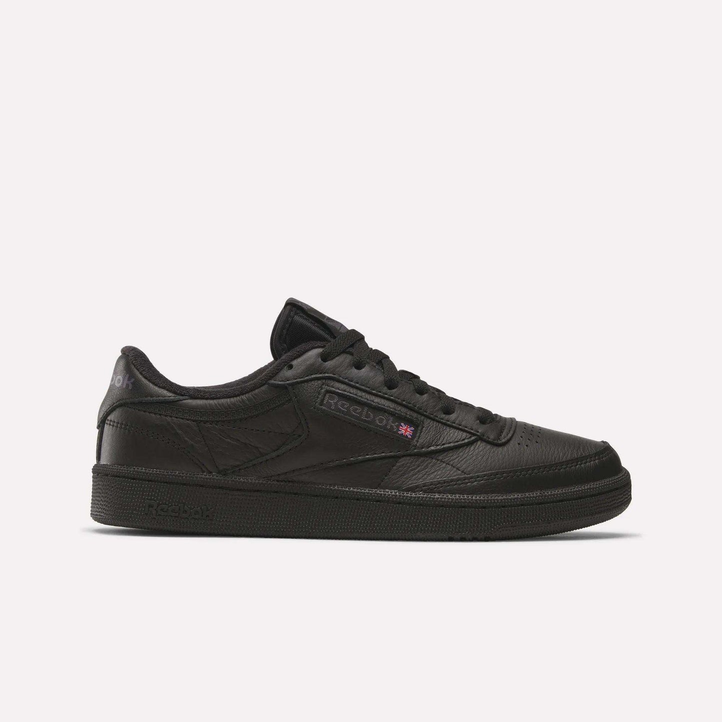 The Reebok Club C 85 Shoes feature a black leather upper, black sole, and black laces in a low-top design, shown in side profile on a plain white background.