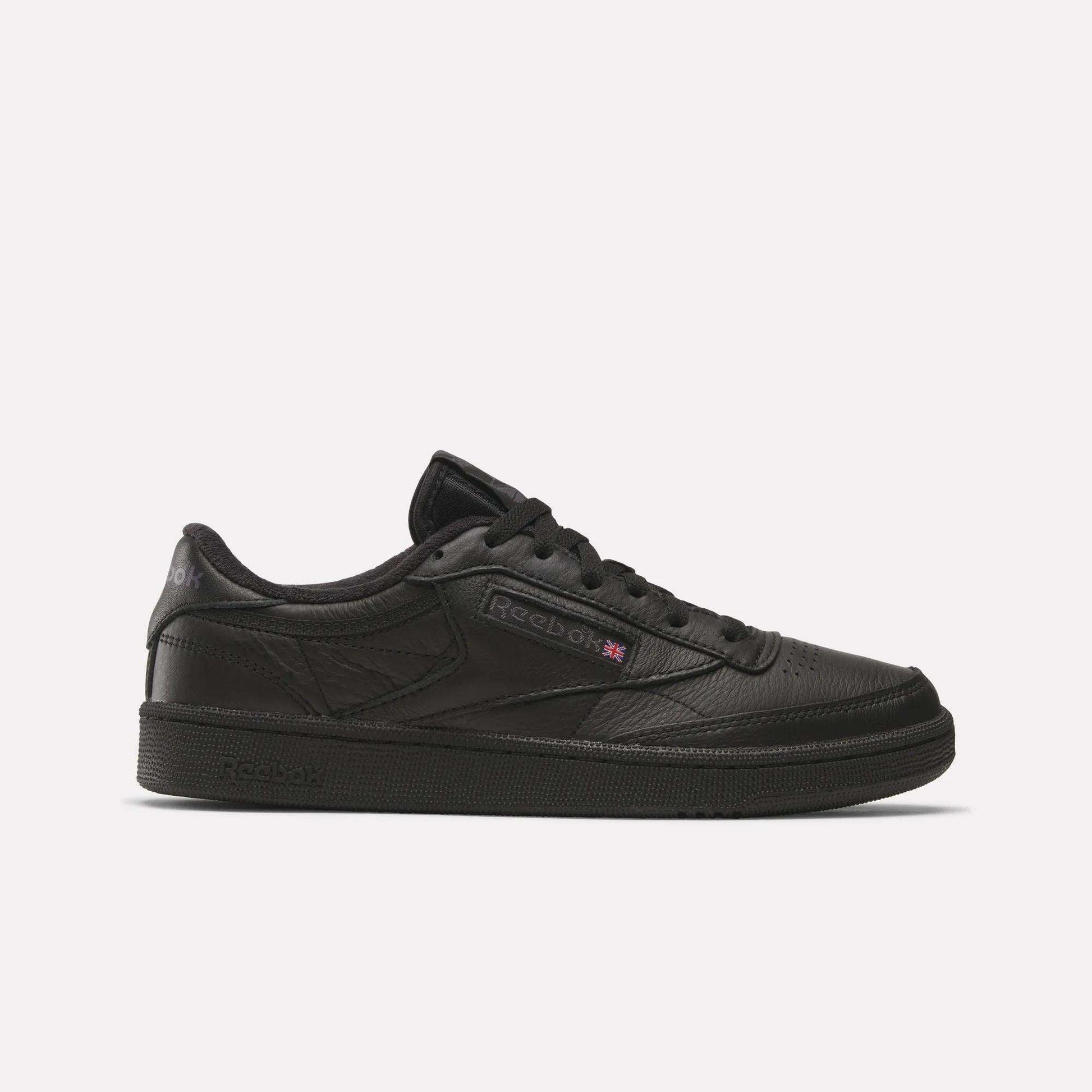 The Reebok Club C 85 Shoes feature a black leather upper, black sole, and black laces in a low-top design, shown in side profile on a plain white background.
