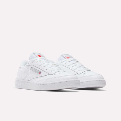 A pair of Reebok Club C 85 Shoes in classic white leather with low tops, subtle branding, and red logo accents, shown on a plain white background.
