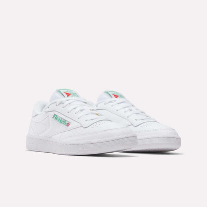 A pair of Reebok Club C 85 Shoes in white leather with green and red logo accents, shown on a plain white background. These tennis-inspired sneakers have a classic low-top design and perforated toe detailing.