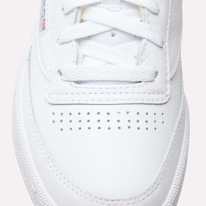 Close-up of the toe box and laces on Reebok Club C 85 Shoes, highlighting their textured leather upper, breathable perforations, and part of the rubber sole inspired by classic tennis style.