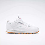 The Reebok Kids' Classic Leather Shoes - Preschool are shown in profile with a white leather upper, gum sole, white laces, stitching details, and the Reebok logo with a Union Jack flag on the side against a plain light background.