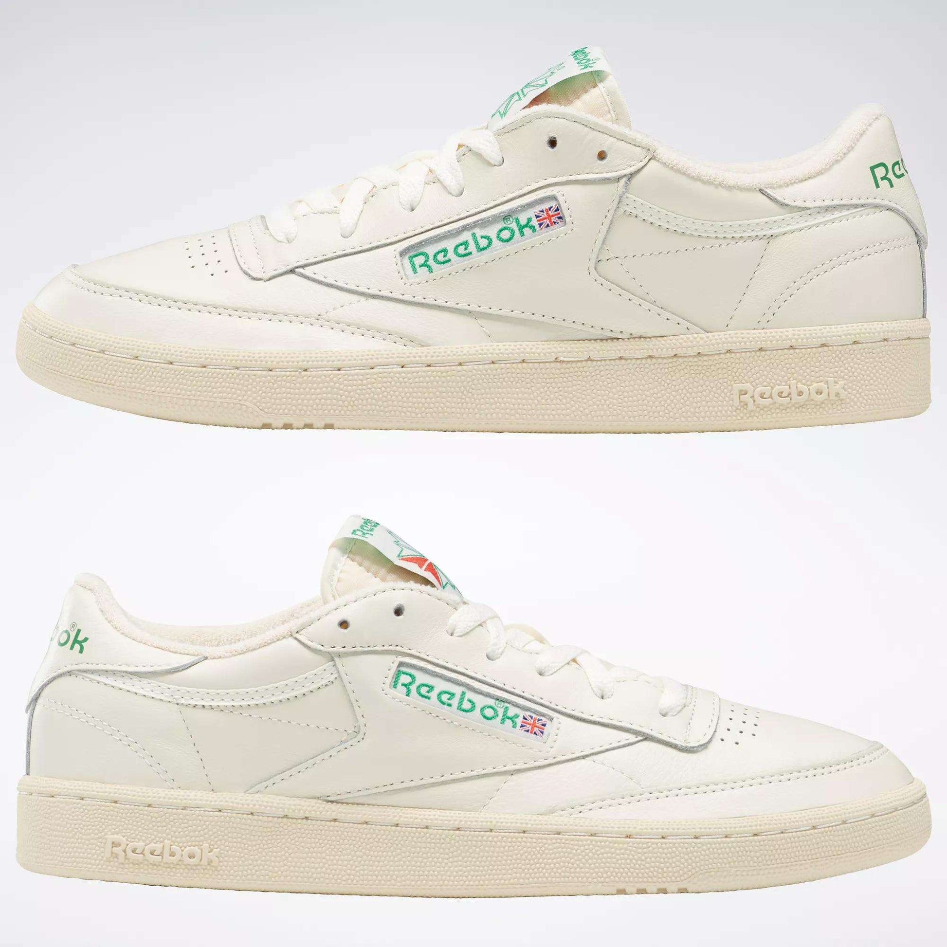 A pair of off-white Reebok Club C 85 Vintage Shoes with a leather upper, green branding, and the Union Jack flag on the side and tongue, shown from both left and right views on a plain background.