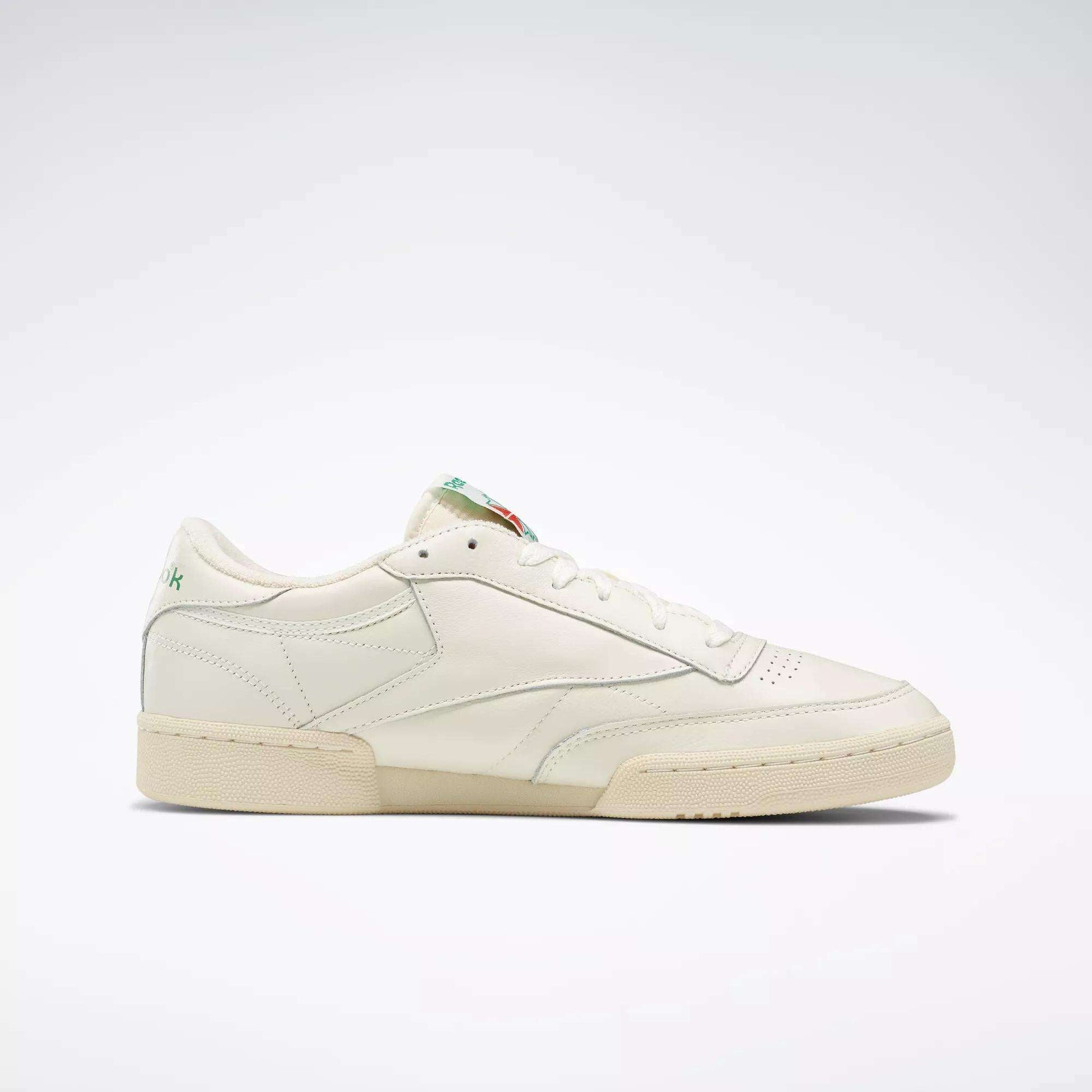 The Reebok Club C 85 Vintage Shoes feature a cream leather upper, low-cut design, minimal stitching, and flat sole, delivering classic court style. Shown against a plain white background.