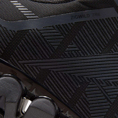 Close-up of the Reebok Men's ZigWild Trail 6 Shoes in black, featuring textured geometric patterns, glossy accents, and “ZIGWILD TR6” on the upper—trail-inspired design with enhanced cushioning for all-day comfort.