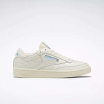 The Reebok Club C 85 Vintage Shoes feature a cream leather upper, blue accents, and a side Reebok logo, shown on a plain white background.