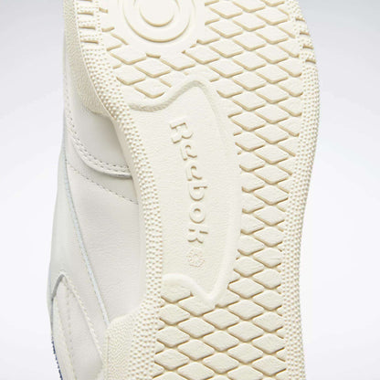 Close-up of the off-white rubber sole on Reebok’s Club C 85 Vintage Shoes, highlighting the textured tread pattern and embossed Reebok logo at the center.