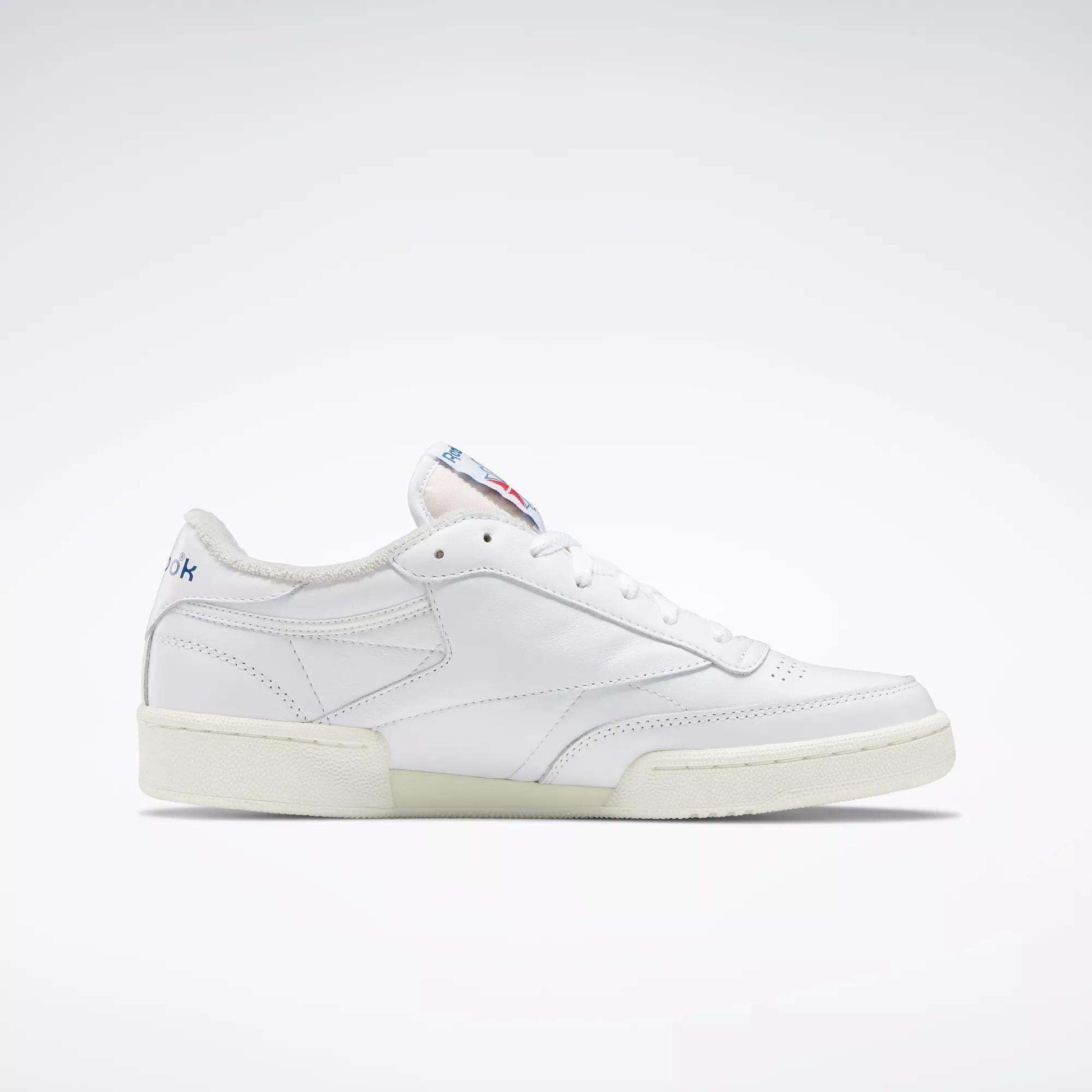 The Reebok Club C 85 Vintage Shoes feature a white leather upper, low-top design, off-white sole, and subtle stitching, shown against a plain light background.