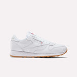 The Reebok Classic Leather Shoes feature a low profile, white leather upper, white laces, and retro gum rubber sole, shown in a side view against a plain light background.