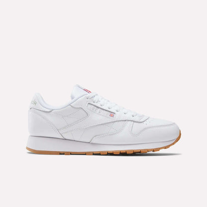 The Reebok Classic Leather Shoes feature a low profile, white leather upper, white laces, and retro gum rubber sole, shown in a side view against a plain light background.